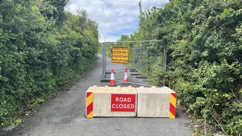 Road block preventing cars from using the road