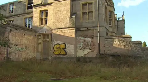 Graffiti on the side of the derelict former asylum