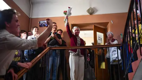 Russian pensioner and activist Lyudmila Vasilyeva, the 84-year-old survivor of the Nazi siege of Leningrad in World War II, leaves a court building after being fined 10.000 rubles (126 US dollars) for "discrediting" the Russian army, in Saint Petersburg on May 23, 2025