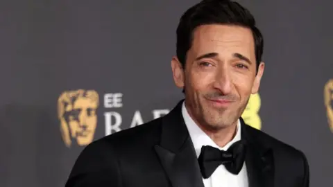 Reuters Adrien Brody in a black tuxedo and bow tie