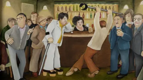 ourberylcook.com/John Cook A group of men are gathered around the bar whilst one man in a pale brown top and brown trousers holds a crutch above his head and points his left foot as if dancing. A man in a white suit with yellow shirt and black platform shoes with brown hells holds the other crutch.