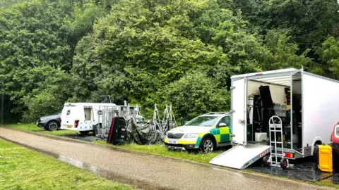 Vans and cars at Fountains Abbey