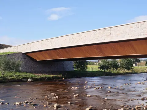 Simon Kennedy Gairnshiel Jubilee Bridge - a close-up of the bridge. Its steel at the bottom and granite above