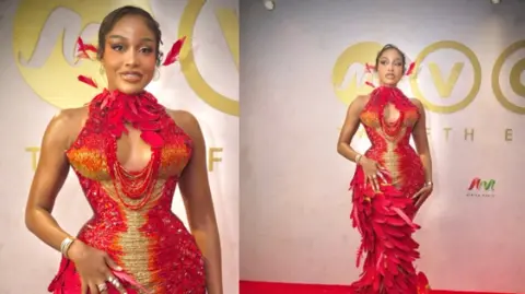 BBC/GIFT UFUOMA Nigerian actress Uche Montana is seen in a red-and-gold-feathered outfit