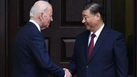 AFP US President Joe Biden greets Chinese President Xi Jinping before a meeting during the Asia-Pacific Economic Cooperation (APEC) Leaders' week in Woodside, California on November 15, 2023