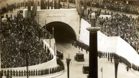 Merseytravel Crowds line the streets around the Queensway Tunnel entrance in 1934