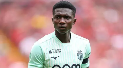 Lamine Camara looking just off camera while playing for Monaco