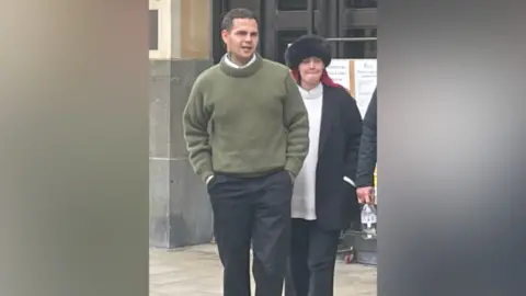 PA Media Tyron Frampton, known by the stage name Slowthai, leaving Oxford Crown Court on Monday alongside his wife Anne-Marie. eiqrtihriqheinv