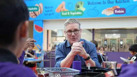 PA Prime Minister Sir Keir Starmer talks to pupils during a visit to Welland Academy, Peterborough, to talk about the importance of free school meals and tackling the cost of living. Picture date: Monday November 24, 2025.