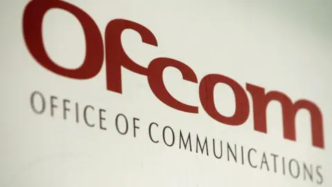 Getty Images Ofcom logo on sign. It reads in red: Ofcom, Office of Communications.