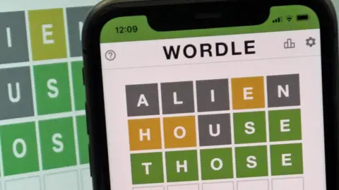 This images shows the screen of an IPhone, showing the screen of the online game, Wordle.