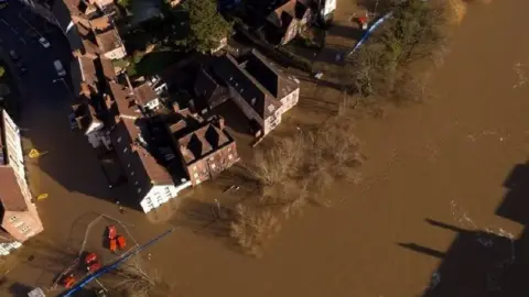 Environment Agency Brown flood water has risen up around properties in Bewdley in 2021 - this is an aerial view 