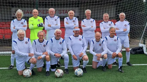 Ken Pollock England Over 75s Football squad photograph in front of football goal