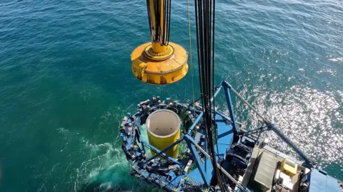 Orsted A wind turbine monopile being installed in the sea off the Norfolk Coast.