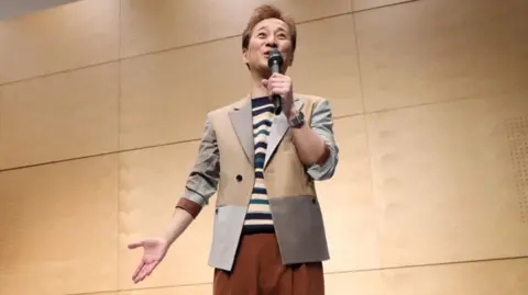 AFP This photo taken on February 2020 shows Masahiro Nakai, a former member of the J-Pop boy band sensation SMAP and a celebrity television host, speaking in Tokyo.