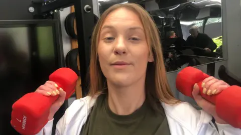 John Devine/BBC Catherine McFadzean holding weights