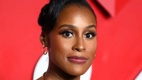 Getty Images Issa Rae head shot, she is looking fairly serious and is staring straight ahead