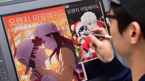 South Korean webtoon artist Seok-Woo working at his office in Bucheon, west of Seoul.