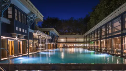 Thames Lido An empty Thames Lido in Reading photo taken at night and the pool is all light up.