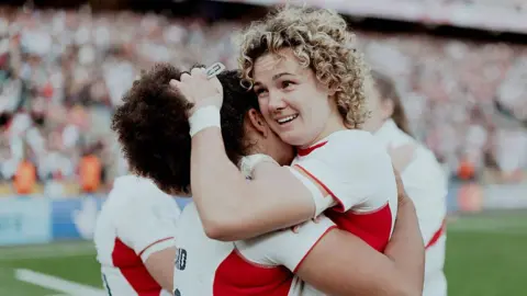 Ellie Kildunne hugging Tatyana Heard at full-time of the World Cup final 