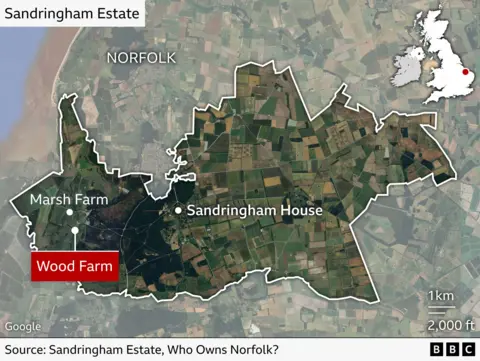 Map of Sandringham Estate in Norfolk, England, showing the estate boundary and key locations. Sandringham House is marked near the centre and Wood Farm highlighted in the far west section of the estate, with Marsh Farm also labelled just to the northwest. Inset map shows the estate’s position in the southeast of the UK.