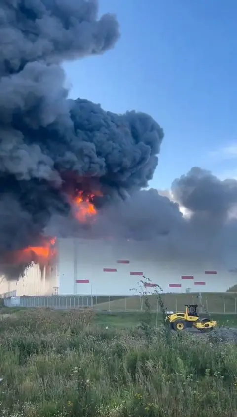 Reuters Huge flames and black smoke rise from a warehouse with similar design to other Wildberries warehouses