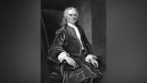 Getty Images Black and white portrait of Sir Isaac Newton seated in a high-backed chair. He has long hair and is wearing a long coat.