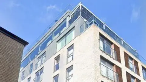 A Google street view image of The Varsity Hotel and Spa in Cambridge. It's a white building with the top two floors featuring lots of glass
