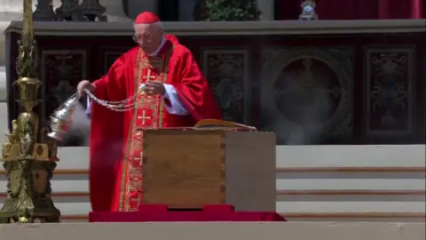 Cardinal Giovanni Battista Re blesses Pope Francis' coffin