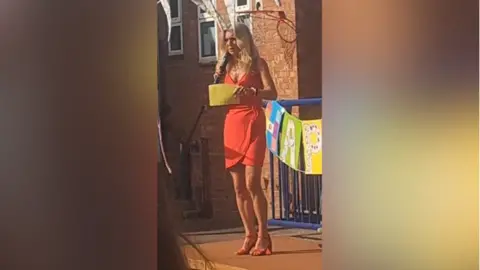 Lynn Knapp Lynn Knapp giving a speech at her leavers party outside the school.