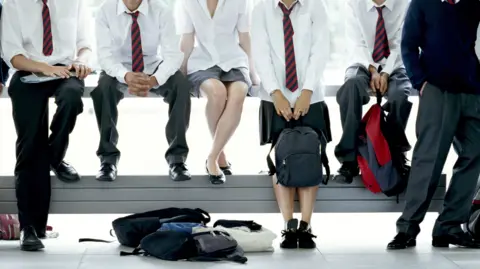 Getty Images Six students wearing school uniforms