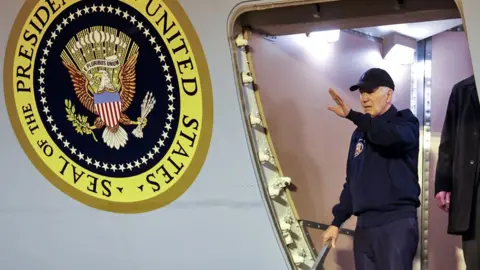 US President Joe Biden gestures as he deboards Air Force One, at Dover Air Force Base in Dover, Delaware, US, on 17 July 2024