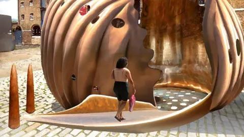 Artist's impression of The Wake - a large bronze shell sculpture with a hollow interior that can be walked inside, with holes in the shell casting light on the ground