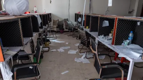 Jonathan Head/BBC Rows of booths lined with sound-proof foam