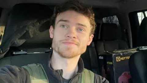 Reuters A smiling Chris Parry in a vehicle