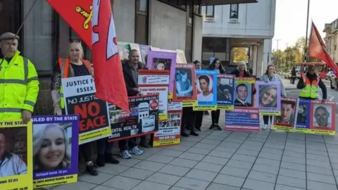 Pete Walker/BBC Protestors outside a coroner's court