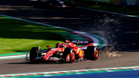 Sparks fly from the back of Charles Leclerc's Ferrari during second practice at Imola