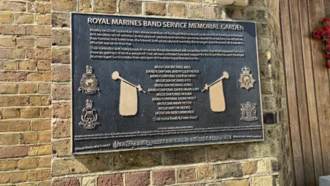 BBC/Jo Burn The sign at the entrance to the Royal Marines' memorial garden