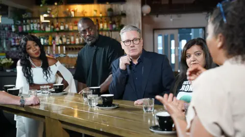 PA Media Idris Elba and Labour leader Sir Keir Starmer meeting families of knife crime victims