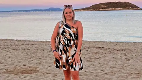 Rachel Smith Rachel Smith standing on the beach