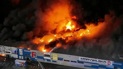 The Marywilska shopping centre on fire. 