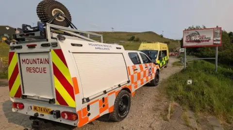 Rossendale and Pendle Mountain Rescue Team Mountain Rescue and ambulance vehicle at the entrance to Lee Quarry in Bacup.