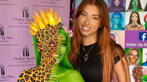 @Makeupbyshaz_xx Shannon on the right standing next to a person who has been half painted green and the half painted in the style of a fiery creature
