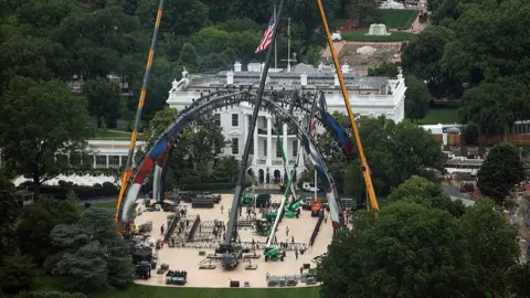Construction continues for the upcoming UFC match on the South Lawn of the White House in Washington, DC.