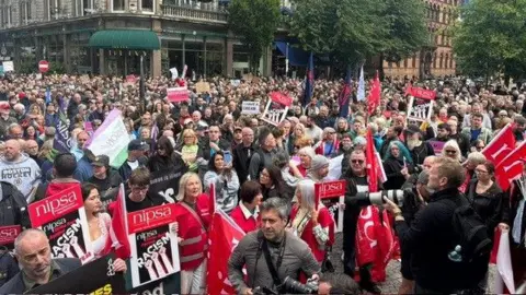 A large crowd gathered outside city Hall