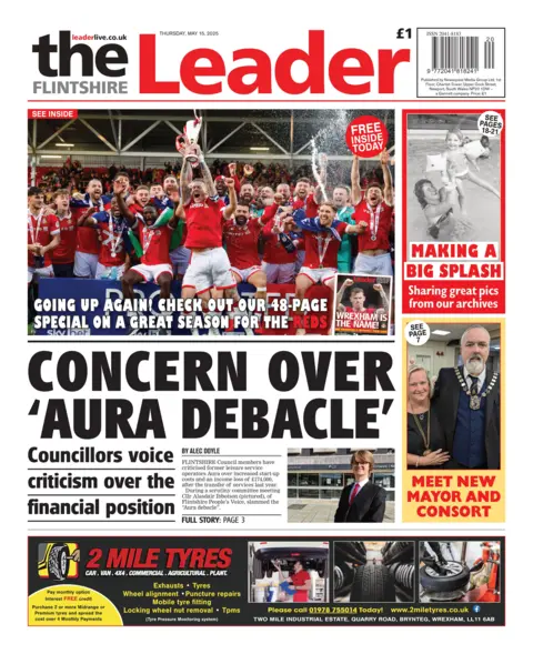 Flintshire Leader Flintshire Leader front page headline next to photo of Councillor Alisdair Ibbotson: Concern over aura debacle; Councillors voice criticism over the financial position. Above this is a photo of the Wrexham football team celebrating.