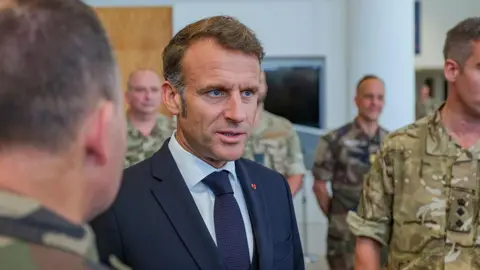 Getty Images Emmanuel Macron meeting soldiers