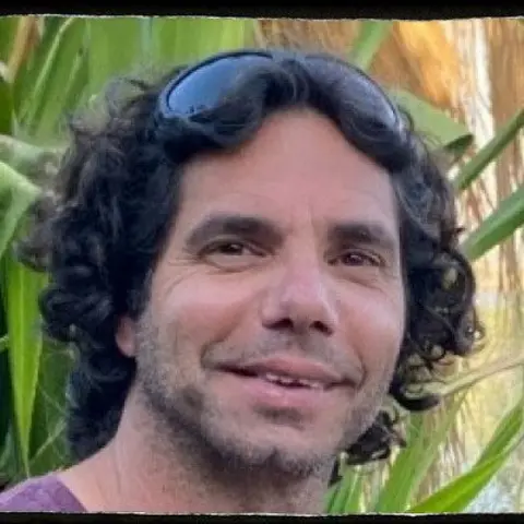 Family handout Ofer Kalderon looks into the camera and smiles, greenery behind him 