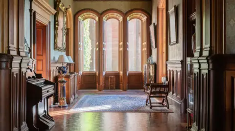 Knight Frank Light pours into a room through three arched windows