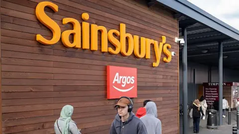 A Sainsbury's store with an Argos logo 